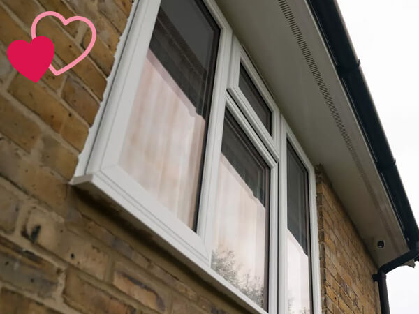 A white UPVC window at the Londons family home