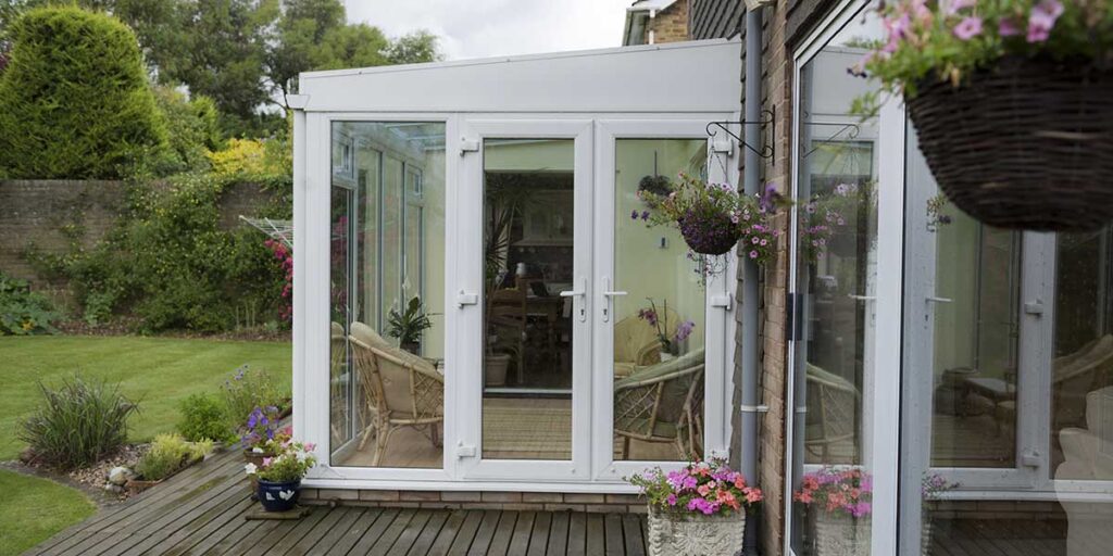 White Lean-To Conservatory with French Doors